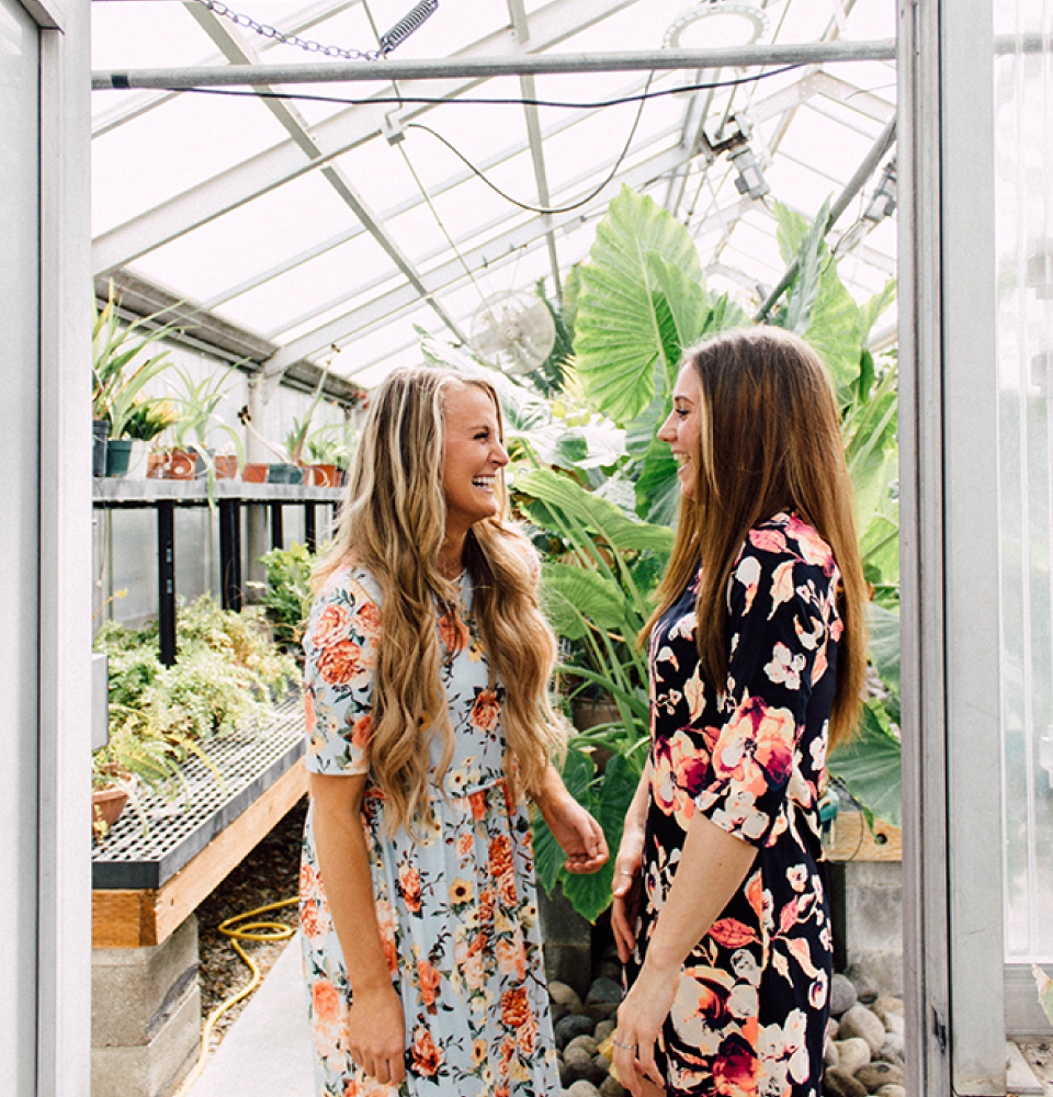 Two girls inside the BYU-Idaho Greenhouse