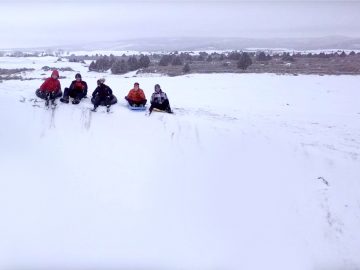 Sledding at the St. Anthony Sand Dunes is legit.