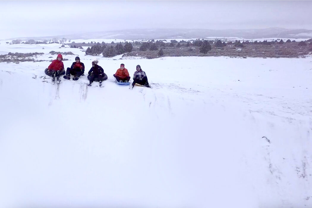 Sledding at the St. Anthony Sand Dunes is legit.