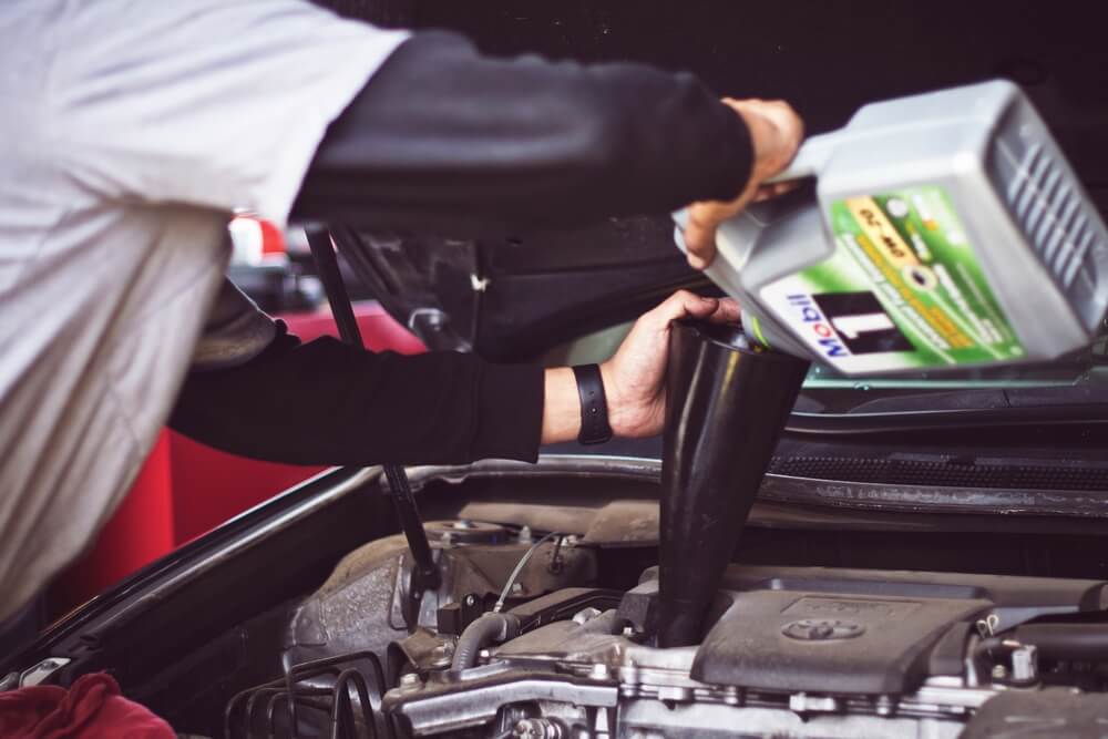 A man doing an oil change