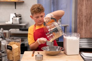 Keaton measuring on Kids Baking Championship